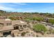 Desert home boasts a covered patio, natural desert landscape, and community views, enhancing outdoor and curb appeal at 15025 E Scarlet Sky Ln # 1, Fountain Hills, AZ 85268