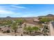 Desert home features desert landscaping, offering curb appeal and privacy on a sunny day at 15025 E Scarlet Sky Ln # 1, Fountain Hills, AZ 85268
