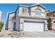 Charming two-story home with desert landscaping and a wide two car garage at 16610 S 21 St, Phoenix, AZ 85048