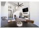 Open-concept living room with fireplace and staircase at 16610 S 21 St, Phoenix, AZ 85048