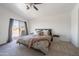 Bedroom featuring a ceiling fan and a sliding glass door to the patio at 16610 S 21 St, Phoenix, AZ 85048