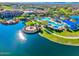 Aerial view of community pool, lake, and recreation areas creating a vibrant outdoor oasis at 17139 S 174Th Dr, Goodyear, AZ 85338