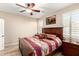 Cozy bedroom with ceiling fan, natural light, and Southwestern-inspired decor at 17139 S 174Th Dr, Goodyear, AZ 85338