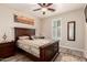 This bedroom is filled with natural light, has a wooden-framed bed and beautiful southwestern decor at 17139 S 174Th Dr, Goodyear, AZ 85338