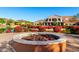 Beautiful community center surrounded by vibrant flowerbeds and lush landscaping near a calming pond at 17139 S 174Th Dr, Goodyear, AZ 85338