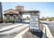 Welcoming Cantamia community entrance featuring a gated entry and lush landscaping at 17139 S 174Th Dr, Goodyear, AZ 85338
