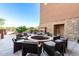 Beautiful courtyard with a stone fire pit and seating area for enjoying outdoor relaxation at 17139 S 174Th Dr, Goodyear, AZ 85338