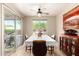 Cozy dining room with contemporary ceiling fan, rustic decor and sliding glass door to outdoor patio at 17139 S 174Th Dr, Goodyear, AZ 85338
