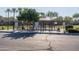 Community dog park entrance showcasing green space, seating, and waste disposal, offering a great spot for pet owners at 17139 S 174Th Dr, Goodyear, AZ 85338