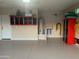 Clean garage featuring wall cabinets, a water heater, and ample storage space, enhancing functionality at 17139 S 174Th Dr, Goodyear, AZ 85338