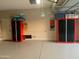 Well-organized garage with red and black storage cabinets, providing ample space for tools and equipment at 17139 S 174Th Dr, Goodyear, AZ 85338