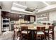 Gourmet kitchen with a large round island, stainless steel appliances, and custom cabinetry at 17139 S 174Th Dr, Goodyear, AZ 85338