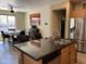 Stylish kitchen with stainless steel appliances, granite countertops, and a dining area with natural light at 17139 S 174Th Dr, Goodyear, AZ 85338
