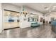 Stylish lobby with fitness center beyond glass, art, and light blue sofa seating against a white wall at 17139 S 174Th Dr, Goodyear, AZ 85338