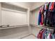 Spacious walk-in closet offering ample storage with shelving on three sides at 17139 S 174Th Dr, Goodyear, AZ 85338