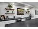 Elegant bar area with custom shelving, a wine-themed painting, and beverage center at 17937 E Colt Ct, Queen Creek, AZ 85142