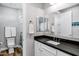 Stylish bathroom with dark countertop, soft lighting, and a walk-in shower at 17937 E Colt Ct, Queen Creek, AZ 85142
