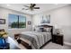 Calming bedroom with a ceiling fan, ample natural light, and sophisticated bedding at 17937 E Colt Ct, Queen Creek, AZ 85142