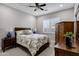 Cozy bedroom featuring a plush bed, stylish furnishings, and shuttered windows at 17937 E Colt Ct, Queen Creek, AZ 85142