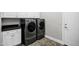 Laundry room featuring modern washer and dryer, with cabinets and countertop at 17937 E Colt Ct, Queen Creek, AZ 85142