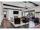 Inviting living room with a fireplace, dark wood floors, and beamed ceilings at 17937 E Colt Ct, Queen Creek, AZ 85142
