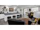 Entertaining living room featuring a sleek bar, plush seating, and modern design at 17937 E Colt Ct, Queen Creek, AZ 85142