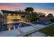 Backyard pool area with an outdoor kitchen and spa at 17937 E Colt Ct, Queen Creek, AZ 85142
