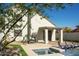 Relaxing backyard showcasing a sparkling pool, a covered patio, and lush greenery for serene outdoor living at 19511 N 76Th Ave, Glendale, AZ 85308