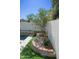 Landscaped backyard featuring a lush garden, stone accents, and privacy wall for a tranquil outdoor retreat at 19511 N 76Th Ave, Glendale, AZ 85308