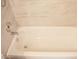 Bright bathroom showcases a tiled bathtub with sleek fixtures and hardware at 19511 N 76Th Ave, Glendale, AZ 85308