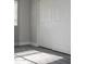 Bedroom featuring gray vinyl flooring, white trim, neutral paint, and a sliding closet door at 19511 N 76Th Ave, Glendale, AZ 85308