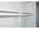 View of the interior of a closet with a shelf, closet rod, and white walls at 19511 N 76Th Ave, Glendale, AZ 85308