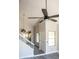 Home's entryway showcases updated flooring, a modern ceiling fan, and an open view into the adjacent kitchen at 19511 N 76Th Ave, Glendale, AZ 85308