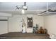 Well-maintained garage featuring a hot water tank, HVAC unit, and space for storing equipment and other essentials at 19511 N 76Th Ave, Glendale, AZ 85308