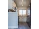 Modern kitchen with white cabinets, stainless steel appliances, subway tile backsplash, and updated flooring at 19511 N 76Th Ave, Glendale, AZ 85308