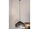 Stylish pendant light fixture hanging from the ceiling, adding a touch of elegance to the room's decor at 19511 N 76Th Ave, Glendale, AZ 85308