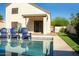 Inviting swimming pool with adjacent landscaping and lush greenery on a bright sunny day at 19511 N 76Th Ave, Glendale, AZ 85308