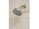 Modern shower head with adjustable settings, set against neutral toned stone, for a spa-like experience at 19511 N 76Th Ave, Glendale, AZ 85308