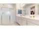 Modern bathroom with dual sinks, a walk-in shower, and bright lighting at 1972 N Loretta Pl, Casa Grande, AZ 85122