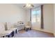 Bright bedroom with a window, desk, and upholstered chairs at 1972 N Loretta Pl, Casa Grande, AZ 85122