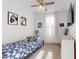 Bright bedroom with a blue patterned bed, gaming decor, and a large window for natural light at 1972 N Loretta Pl, Casa Grande, AZ 85122
