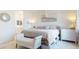 Relaxing bedroom featuring a comfortable bed, ample natural light, and an ensuite bathroom at 1972 N Loretta Pl, Casa Grande, AZ 85122