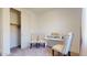 Bright bedroom with a closet, desk, and upholstered chairs at 1972 N Loretta Pl, Casa Grande, AZ 85122