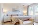 Comfortable bedroom with a large window, decorative lighting, and neutral color scheme at 1972 N Loretta Pl, Casa Grande, AZ 85122