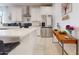 Modern kitchen featuring stainless steel appliances, island, and tile flooring at 1972 N Loretta Pl, Casa Grande, AZ 85122