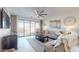 Cozy living room with a large sliding glass door leading to the outdoor space and a neutral color palette at 1972 N Loretta Pl, Casa Grande, AZ 85122