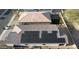 Aerial view of house with solar panels and a clay tile roof in a residential neighborhood at 1972 N Loretta Pl, Casa Grande, AZ 85122