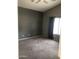 Bedroom with neutral carpet, a window, and ample wall space at 21214 N 80Th Ln, Peoria, AZ 85382