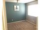 Bedroom with blue accent wall, ceiling fan, and bright window at 21214 N 80Th Ln, Peoria, AZ 85382