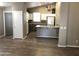 Open kitchen with white cabinets, stainless steel appliances, and a breakfast bar at 21214 N 80Th Ln, Peoria, AZ 85382